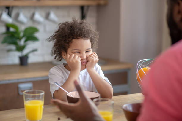 istock Cute little kid looking naughty refusing to eat 1227490870