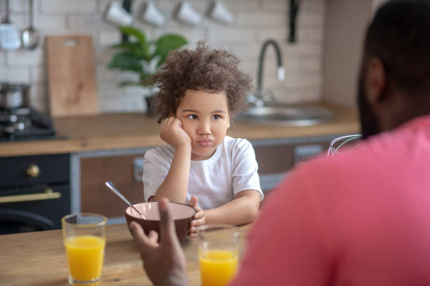 istock Cute little kid looking sad having no appetite 1227490871