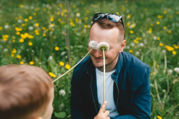 istock Father playing with son in park 1227492451