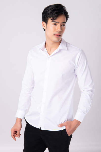 istock Handsome man wearing a white shirt on white background, 1227494731