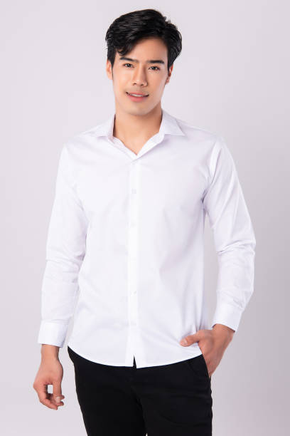 istock Handsome man wearing a white shirt on white background, 1227494732