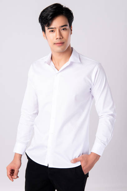 istock Handsome man wearing a white shirt on white background, 1227494733