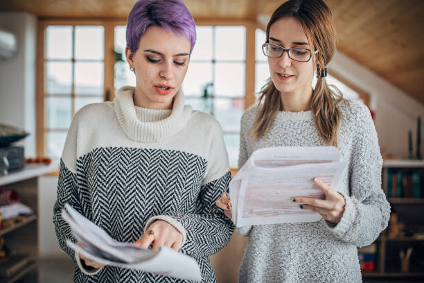 istock Female students studying together at home 1227501094