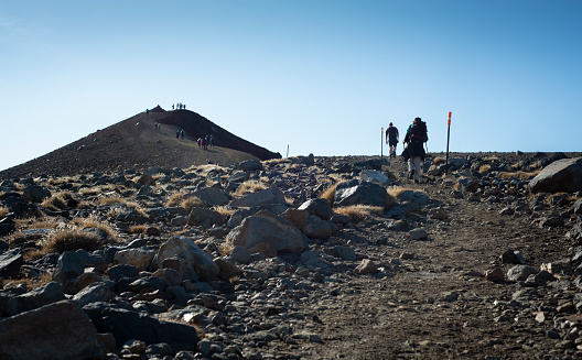Trampers climbing up the Red Crater on the Tongariro Alpine Crossing