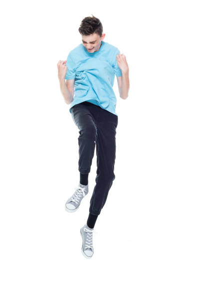 istock Caucasian boys jumping in front of white background 1227502634