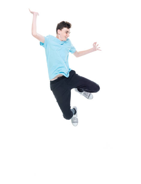 istock Caucasian male jumping in front of white background 1227503376