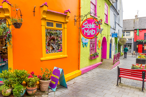 Kinsale, Cork, Ireland - 06 May, 2018: Colorful houses in the Market street and the Newman's Mall. The historic streetscape is a famous holiday destination.