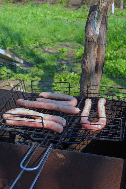 Grilled sausages at the stake