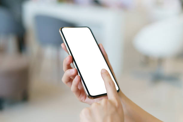 istock Mockup image of hand holding mobile phone with blank white screen. 1227505593