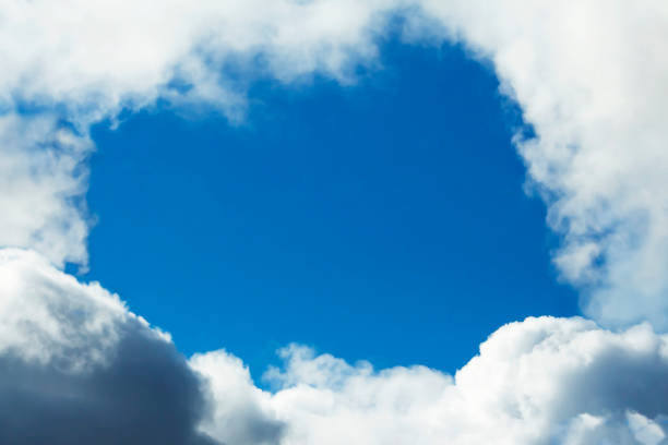 the blue sky Peeps through the clouds, a copy of space.