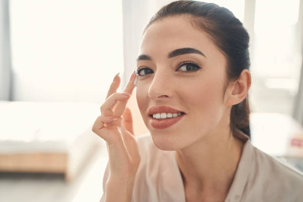 istock Beautiful smiling young lady making home spa procedures for skin 1227512312