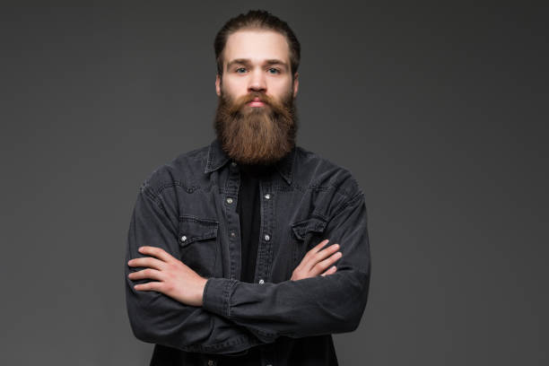 istock Attractive long beard man hands crossed isolated grey background 1227514316