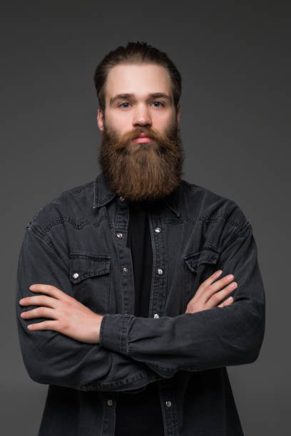 istock Attractive long beard man hands crossed isolated grey background 1227514429