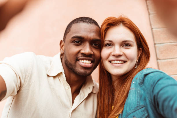 istock interracial couple take a selfie portrait together 1227514497