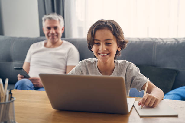 istock Two family members sitting and smiling sincerely 1227514731