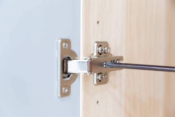 istock Polished Stainless door hinge on a cabinet door for interior design. 1227515679