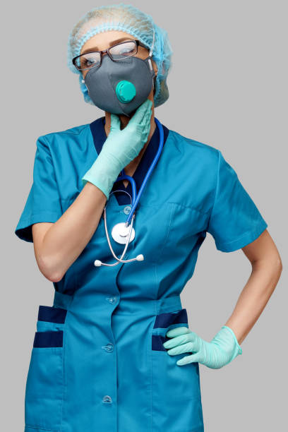 medical doctor nurse woman wearing protective mask and rubber or latex gloves - neck illness - cought imagens e fotografias de stock