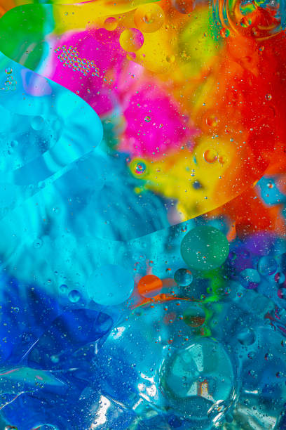 Colorful abstract  background in bright  and warm colors, blurred smooth image with water and oil.