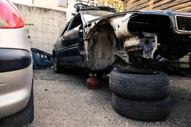 istock Wrecked old car at parking lot front view 1227522040