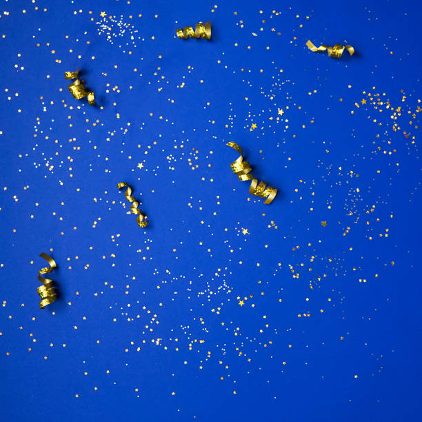 istock Golden decorations and sparkles on bright background 1227529211