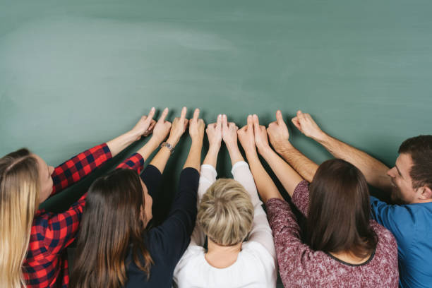 istock Enthusiastic group of students giving a thumbs up 1227530039