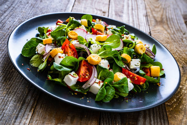 istock Greek salad on wooden table 1227532063