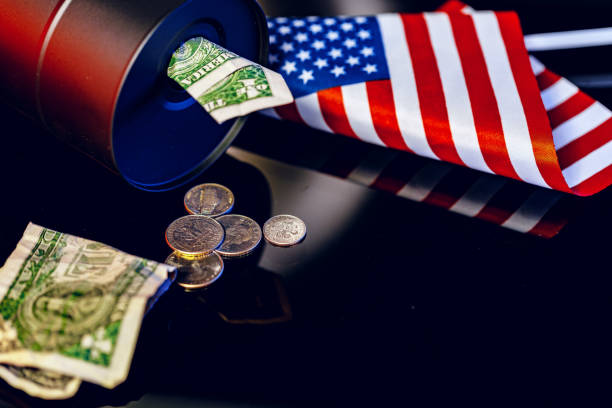 istock Oil prices fall concept. Oil barrel against decline chart 1227532092