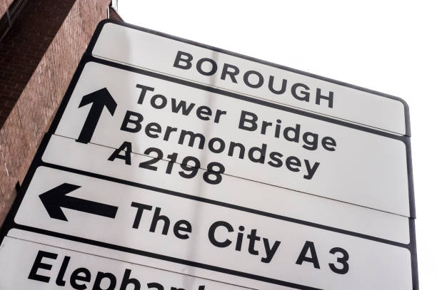 Road sign in Borough, indicating the direction to Tower Bridge, Bermondsey and The City, in London, England
