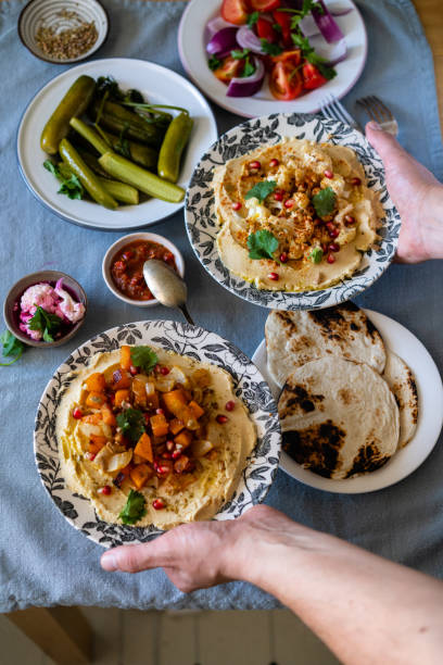 istock Homemade hummus, pita bread and vegetables 1227535177