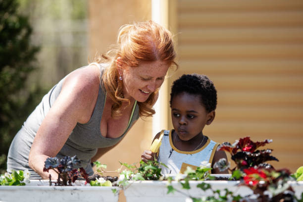 istock Woman gardening with her son 1227538759
