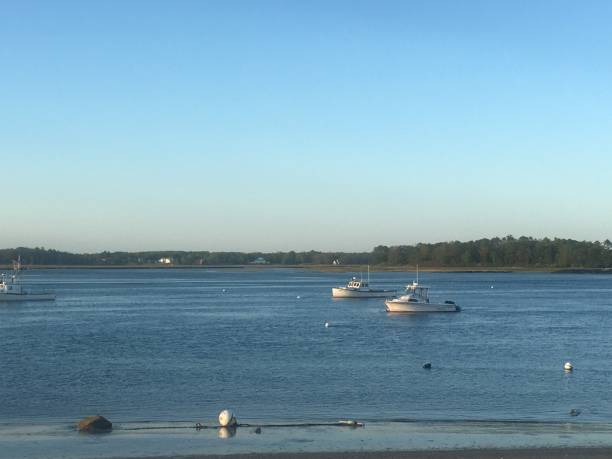 istock Two lobster boats at sunset 1227538789