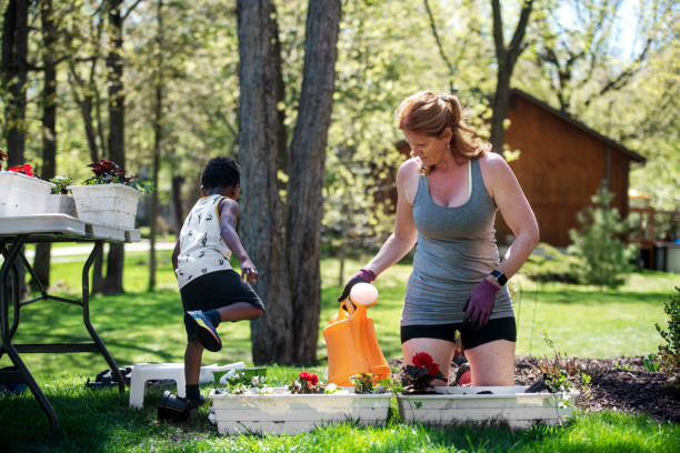 istock Woman gardening with her son 1227539340