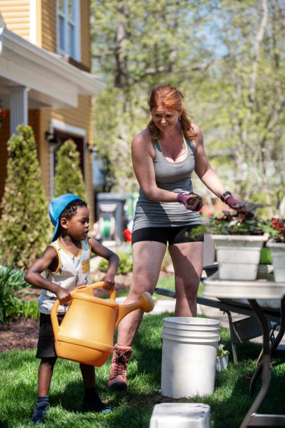 istock Woman gardening with her son 1227539342
