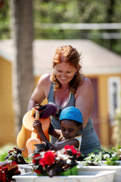 istock Woman gardening with her son 1227539467
