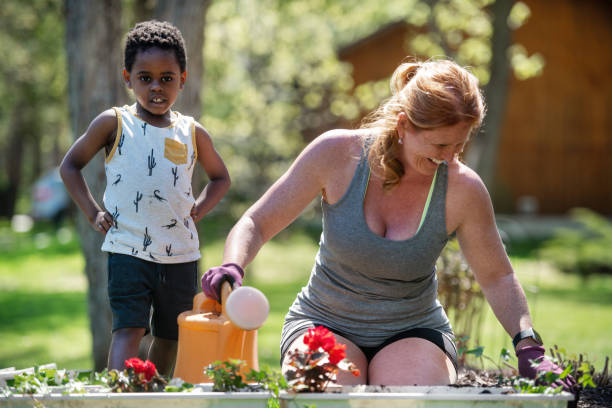istock Woman gardening with her son 1227539545
