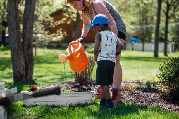 istock Woman gardening with her son 1227539620