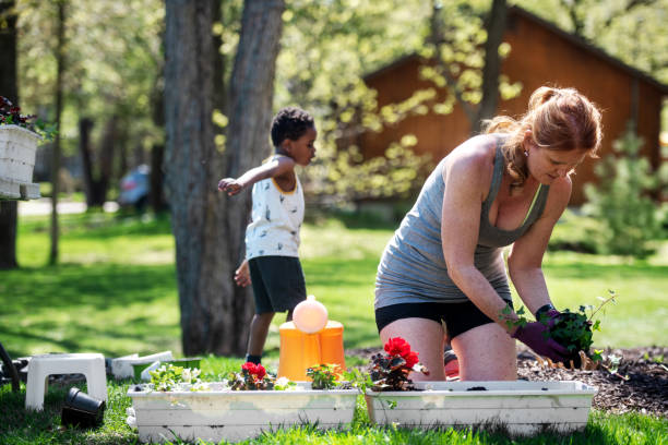 istock Woman gardening with her son 1227539658