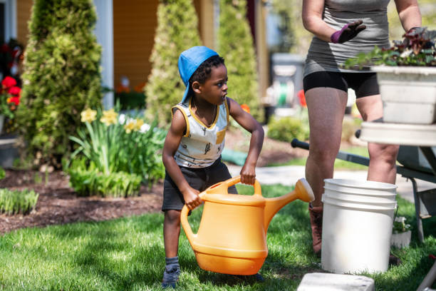 istock Woman gardening with her son 1227539663