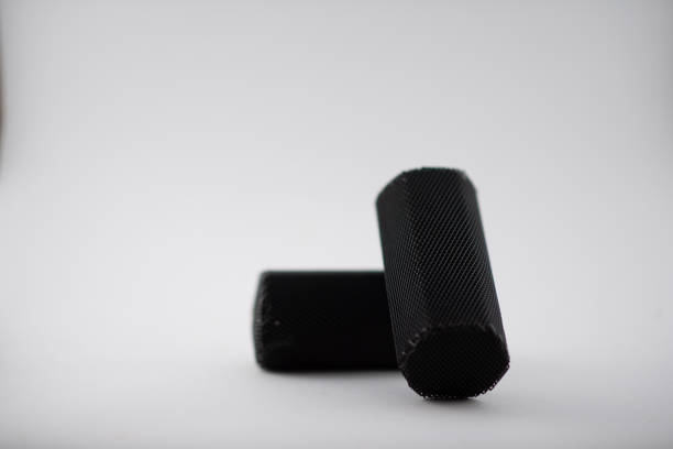 istock Charcoal briquettes on white background 1227539758