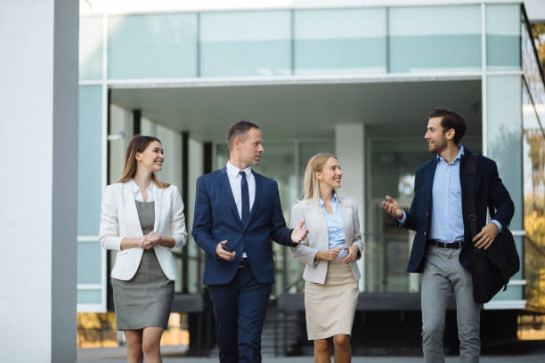 istock Four young executives discussing ideas outdoors 1227539886