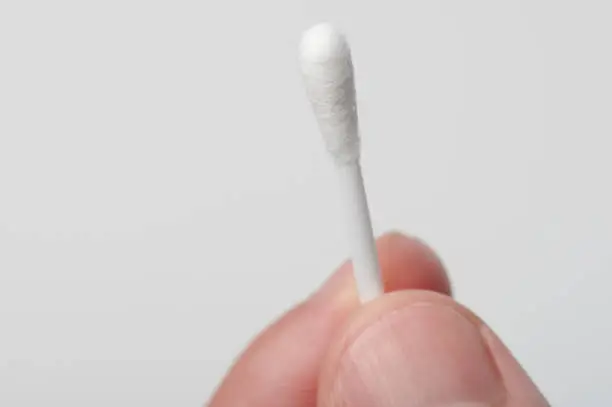 Photo of One cotton stick in hand
