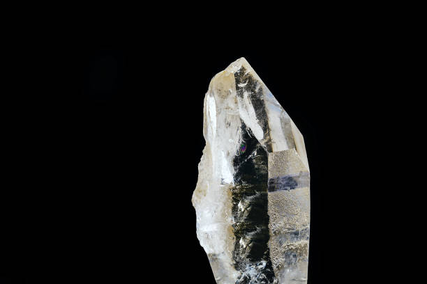 istock Quartz is the second most abundant mineral on earth and has a trigonal crystal structure composed of silica tetrahedra. Mining concept, semi precious rough stone. 1227539924