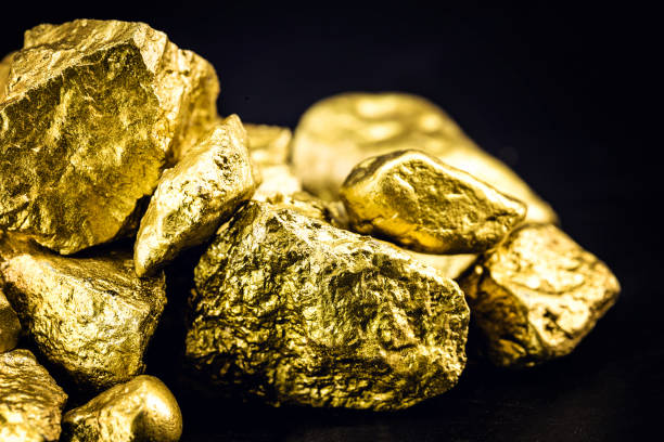 istock Golden nuggets isolated on black background. Luxury concept. 1227540023