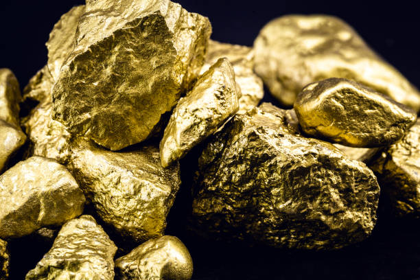 istock Golden nuggets isolated on black background. Luxury concept. 1227540034