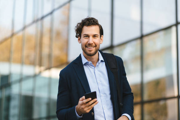 istock Young businessman typing text message on his way to work 1227540126