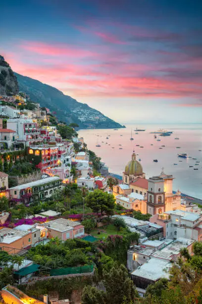 Aerial image of famous city Positano located on Amalfi Coast, Italy during sunrise.