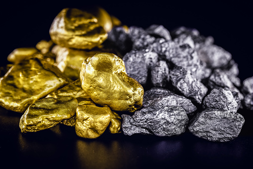 stones of gold and silver gross, mineral extraction of gold and silver. Concept of luxury and wealth.