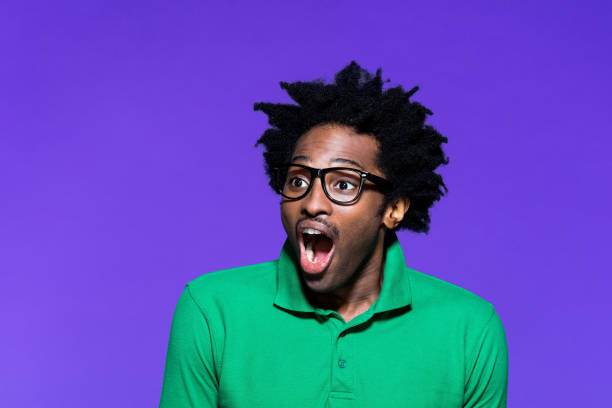 istock Colored portrait of excited young man with dreadkocks 1227543716