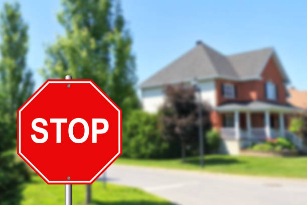 Stop sign at an intersection with a street in the background