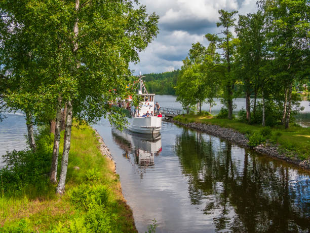 Håverud, Sweden - June 28, 2015: Passenger boat with tourists in a canal